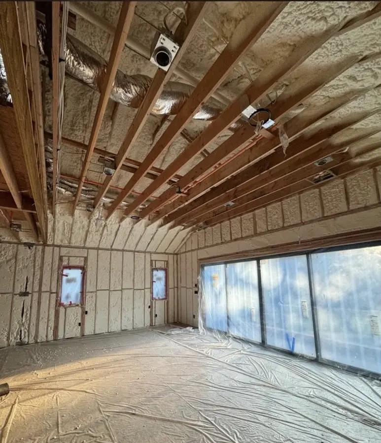 Interior walls and ceiling insulated with spray foam during new construction in Silver Firs